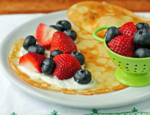 Crepes with Yogurt and Berries on a plate