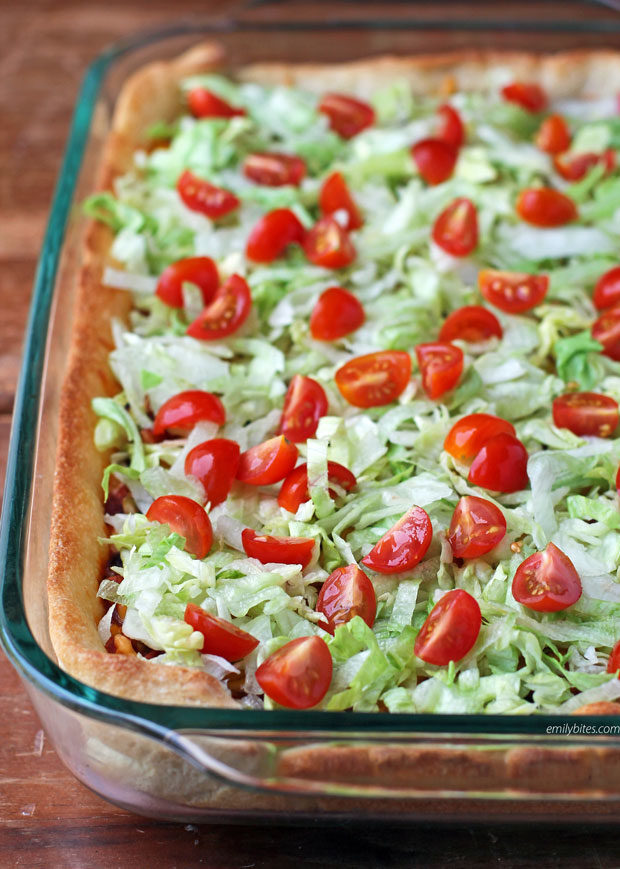 Deep Dish Taco Casserole with lettuce and tomatoes