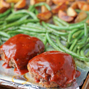 Sheet Pan Meatloaves with Roasted Potatoes and Green Beans on the pan