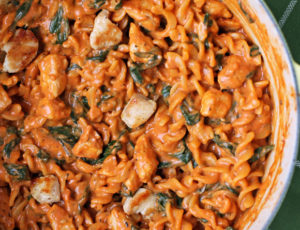 One-Pot Creamy Tomato Pasta with Chicken and Spinach in a pot