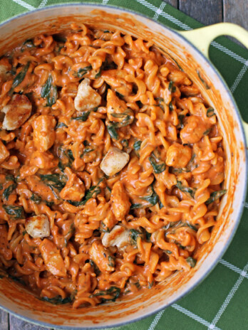 One-Pot Creamy Tomato Pasta with Chicken and Spinach in a pot