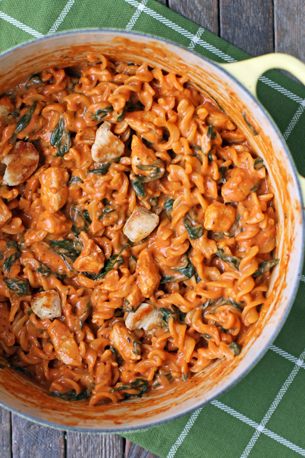 One-Pot Creamy Tomato Pasta with Chicken and Spinach in a pot