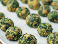 Spinach Balls lined up on a cookie sheet