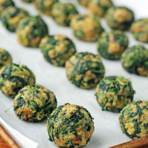 Spinach Balls lined up on a cookie sheet