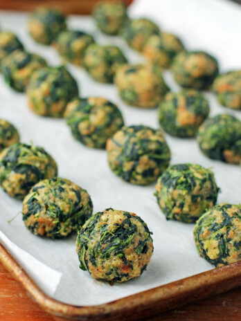 Spinach Balls lined up on a cookie sheet