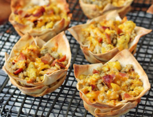 Breakfast Wonton Cups lined up on a cooling rack