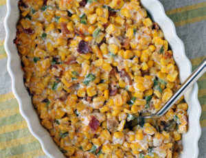 Creamy Corn with Bacon and Jalapenos being scooped