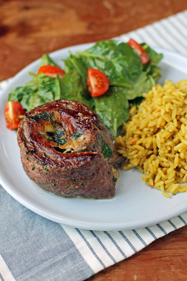 Garlic Parmesan Flank Steak Pinwheel with salad and rice