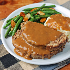 Meatloaf with Gravy on a plate with sides