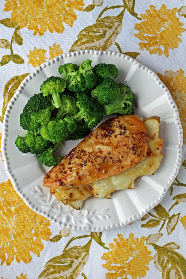 Apple and Brie Stuffed Chicken plated with broccoli