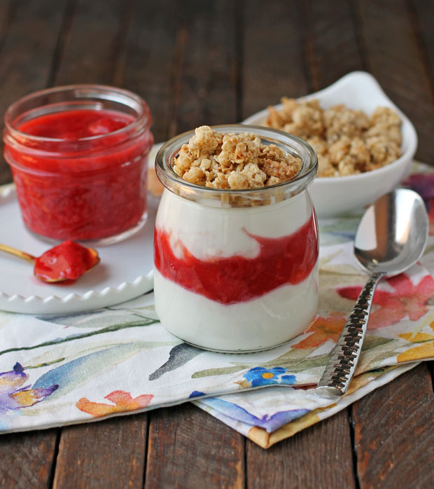 A Make-Ahead Berry Yogurt Parfait with granola and strawberry sauce