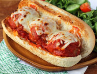 Beef and Turkey Meatball Sub plated with salad