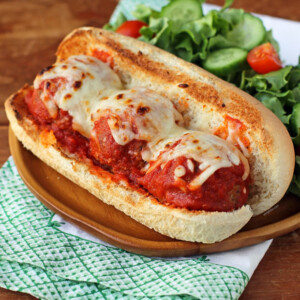 Beef and Turkey Meatball Sub plated with salad