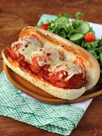 Beef and Turkey Meatball Sub plated with salad