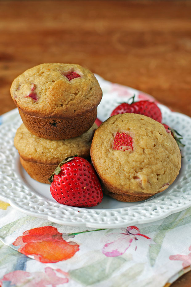 Strawberry Rhubarb Muffins stacked on a plate