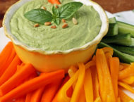 Basil Hummus in a bowl with veggies