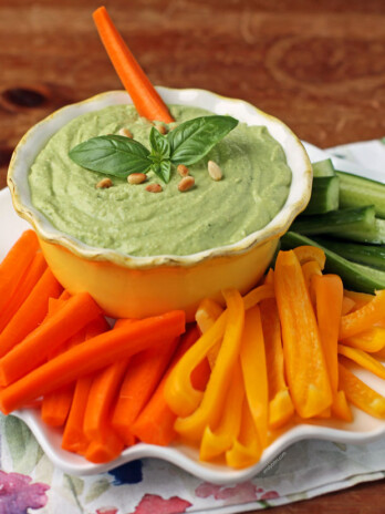 Basil Hummus in a bowl with veggies