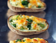Broccoli Cheddar Twice Baked Potatoes on a baking sheet