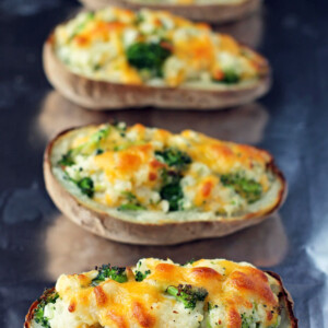 Broccoli Cheddar Twice Baked Potatoes on a baking sheet