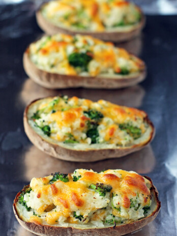 Broccoli Cheddar Twice Baked Potatoes on a baking sheet