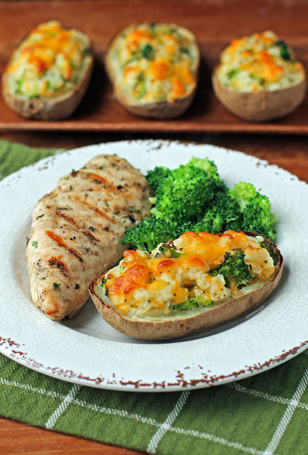 Broccoli Cheddar twice Baked Potatoes on a plate with chicken