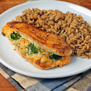 Cheese Broccoli Stuffed Chicken on a plate with rice