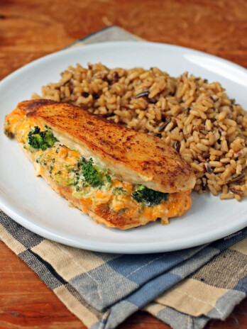 Cheese Broccoli Stuffed Chicken on a plate with rice
