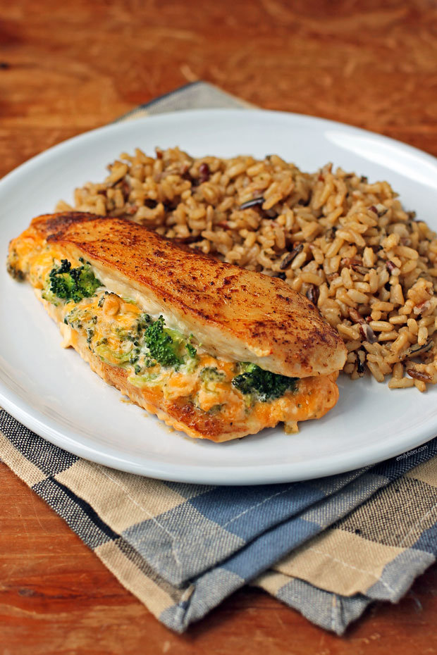 Cheese Broccoli Stuffed Chicken on a plate with rice