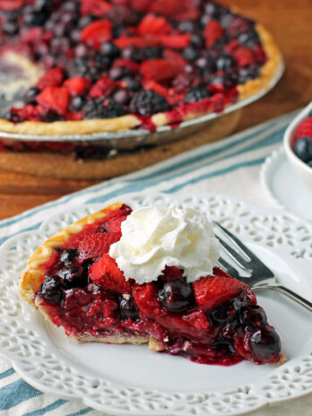 Mixed Berry Pie slice with whipped cream