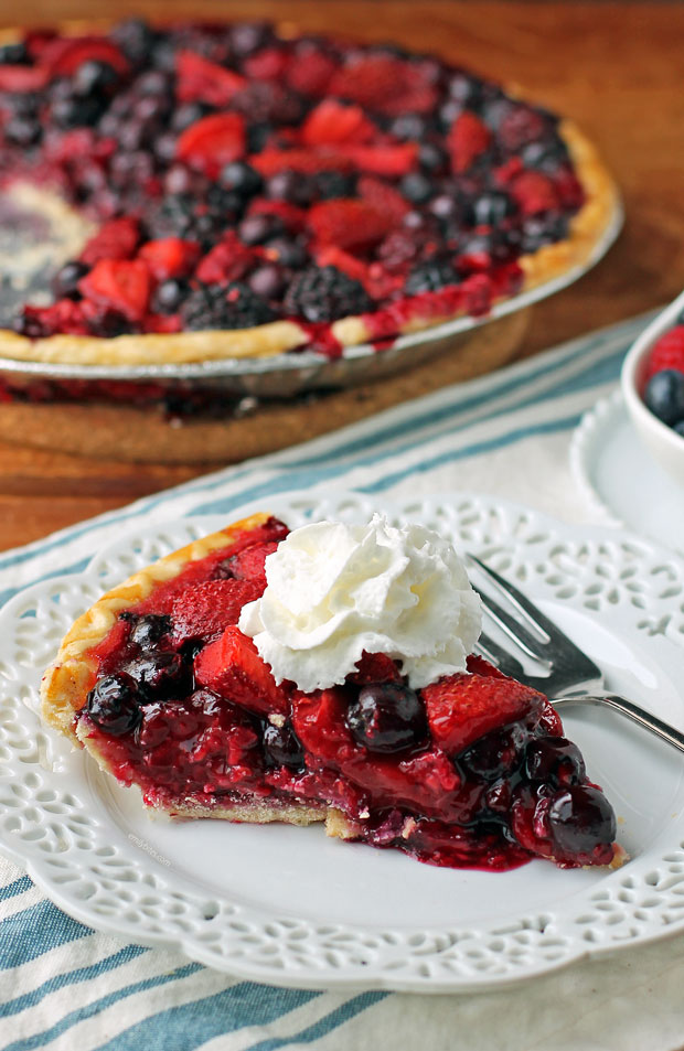 Mixed Berry Pie slice with whipped cream