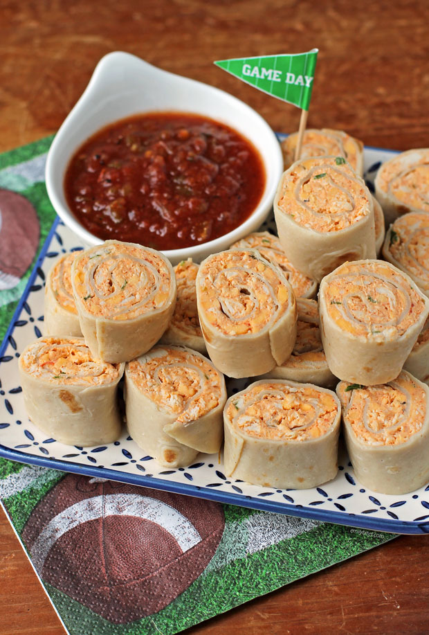 Chicken Taco Tortilla Pinwheels piled on a plate with salsa