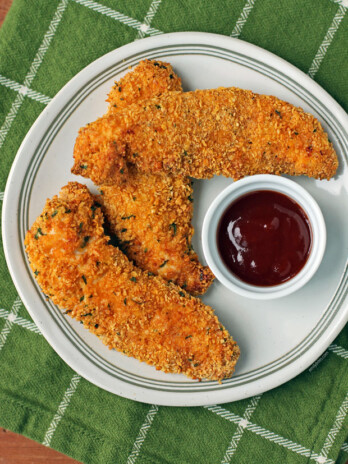 Air Fryer Chicken tenders on a plate with BBQ sauce