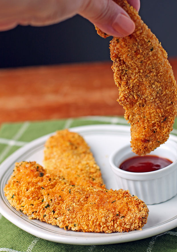 Air Fryer Chicken Tender being dipped in sauce