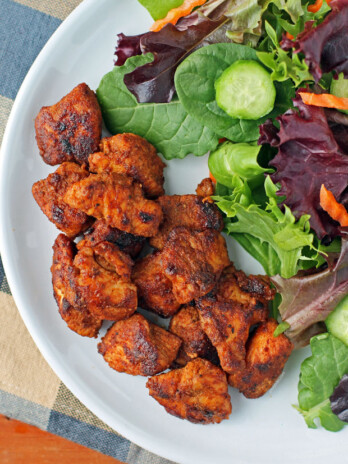 Barbecue Rubbed Chicken Bites plated with salad