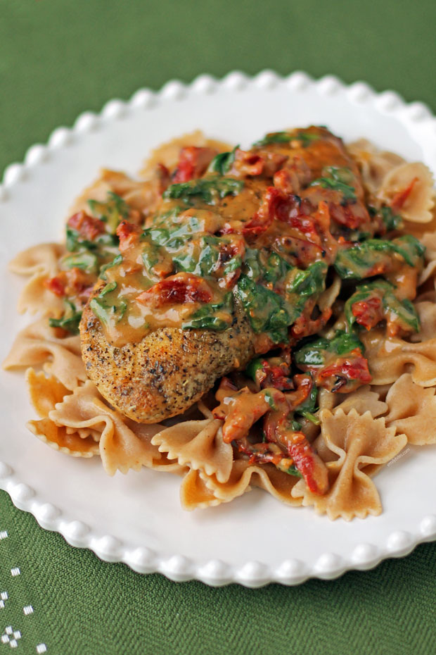 Creamy Tuscan Chicken plated with pasta