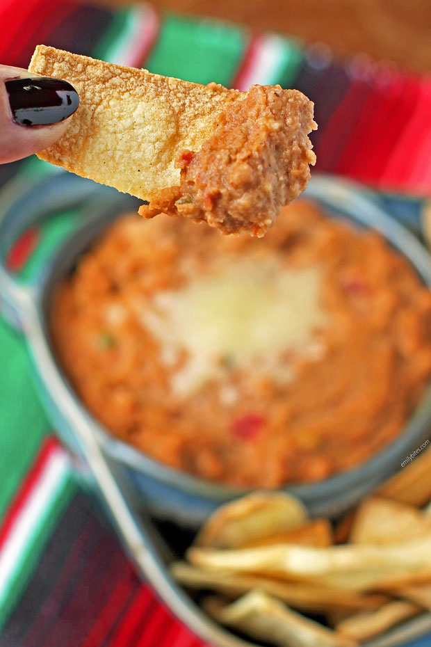 Easy Cheesy Bean Dip on a tortilla chip