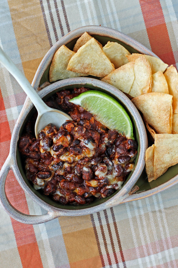 Cheesy Spicy Black Beans in a bowl with tortilla chips