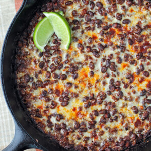 Cheesy Spicy Black Bean Skillet with lime