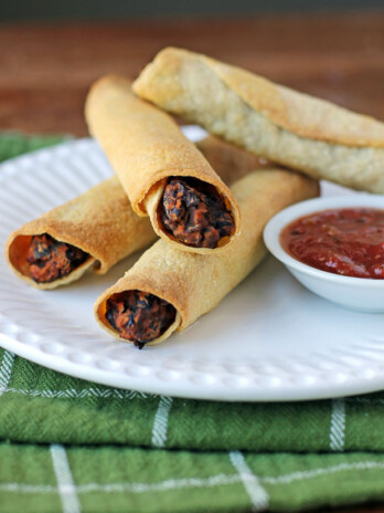 Black Bean Taquitos on a plate with salsa