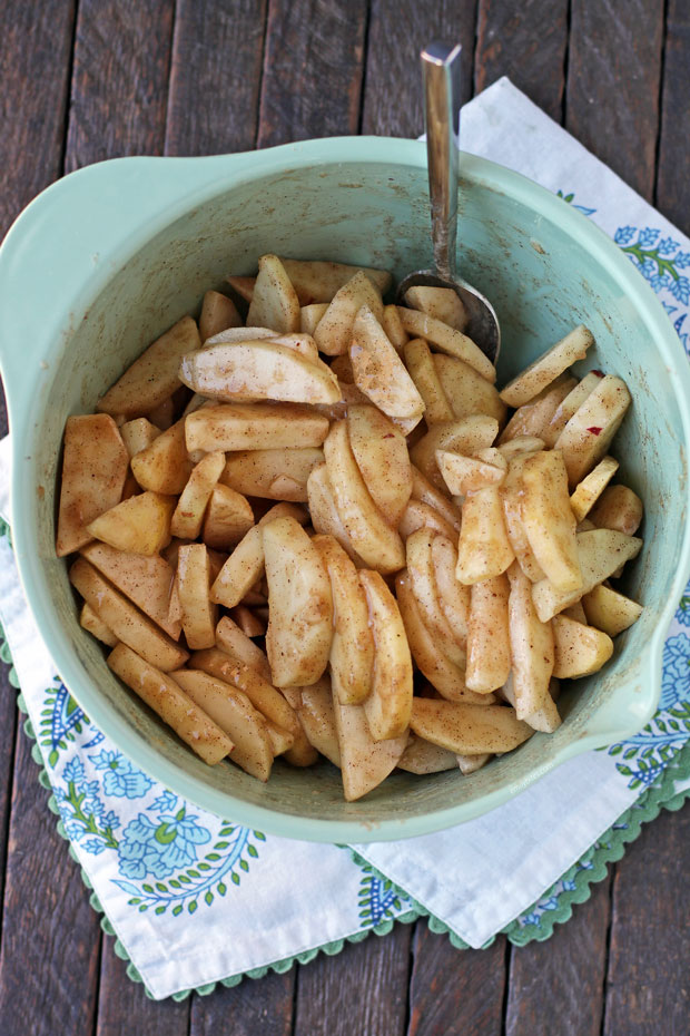 Cinnamon sugar apples in a mixing bowl