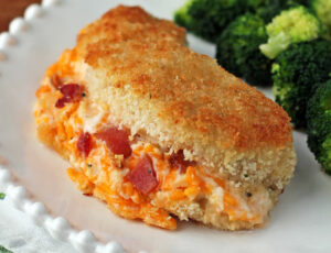 Cheesy Bacon Ranch Stuffed Chicken on a plate with broccoli