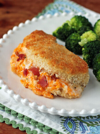 Cheesy Bacon Ranch Stuffed Chicken on a plate with broccoli