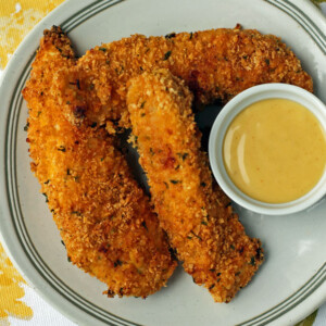 Honey Mustard Chicken Tenders on a plate with sauce