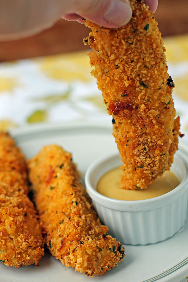 Honey Mustard Chicken Tender getting dipped