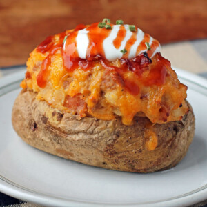 Loaded BBQ Stuffed Twice Baked Potatoes with toppings