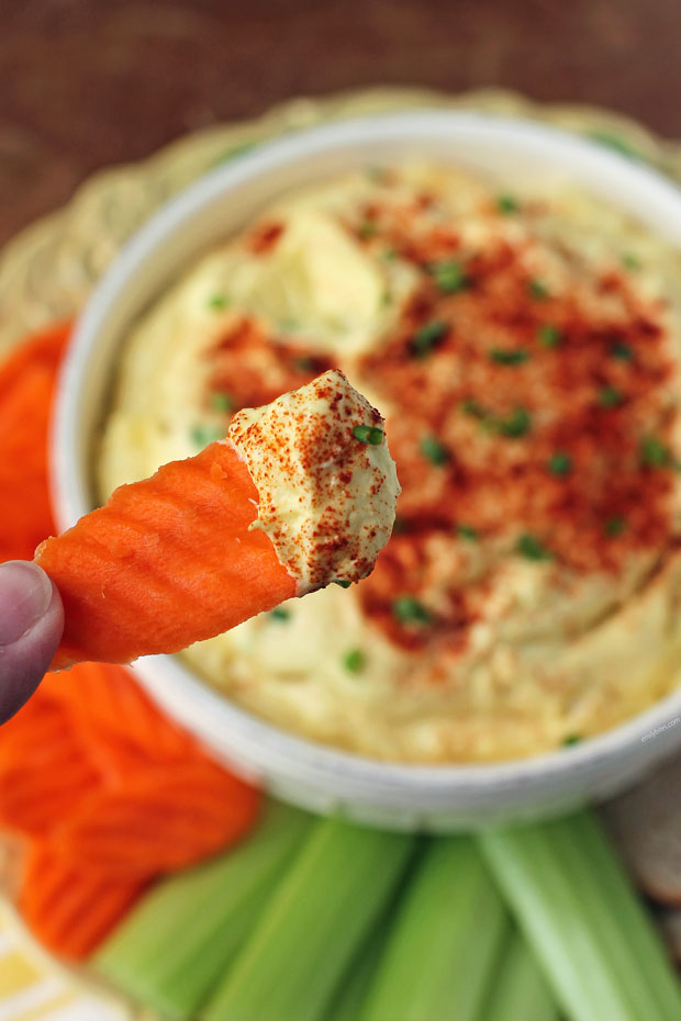 Deviled Egg Dip on a carrot