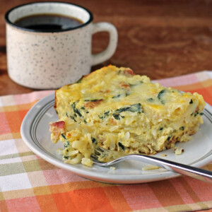 Bacon and Spinach Hash Brown Egg Bake with a forkful