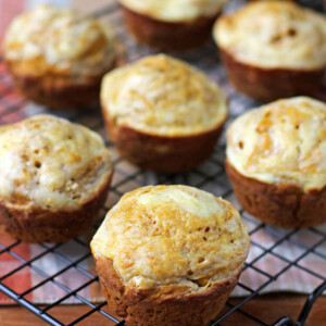 Pumpkin Cream Cheese Swirl Muffins on a cooling rack