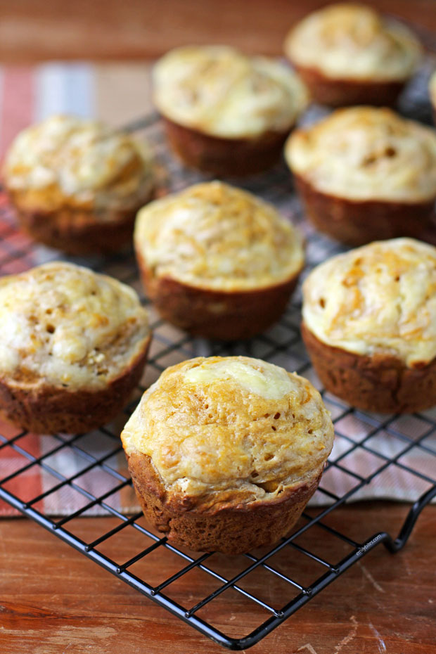 Pumpkin Cream Cheese Swirl Muffins on a cooling rack