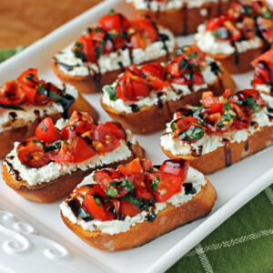 Tomato and Goat Cheese Bruschetta on a serving platter